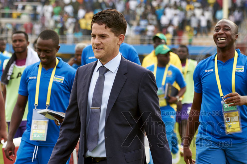 Coach McKinstry and the technical team leave the field following their win [Rwanda vs Gabon, CHAN - Group A, 20 Jan 2016 in Kigali, Rwanda.  Photo © Darren McKinstry 2016, www.XtraTimeSports.net]